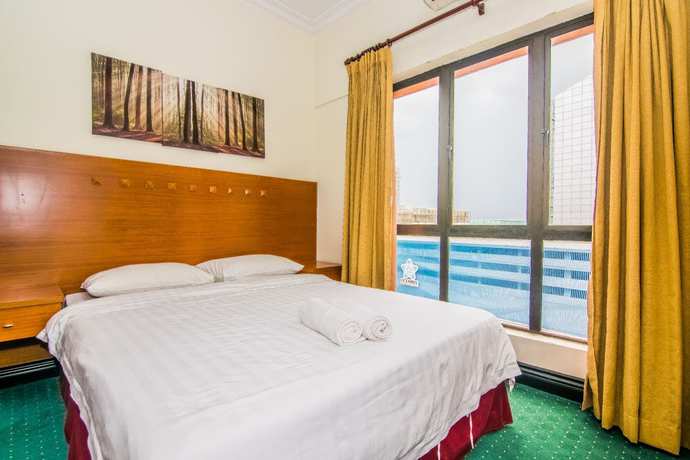 Imagen de la habitación del Hotel Marina Travellers Suite Marina Court. Foto 13