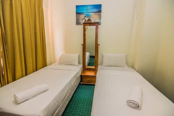 Imagen de la habitación del Hotel Marina Travellers Suite Marina Court. Foto 17