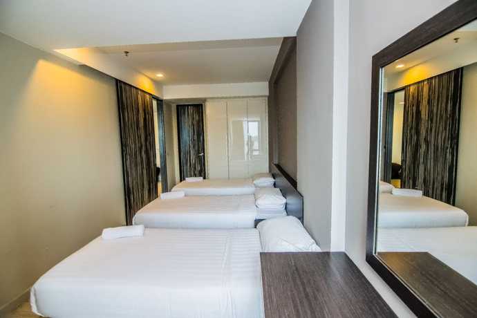 Imagen de la habitación del Hotel Marina Travellers Suite SKY Karamunsing. Foto 3