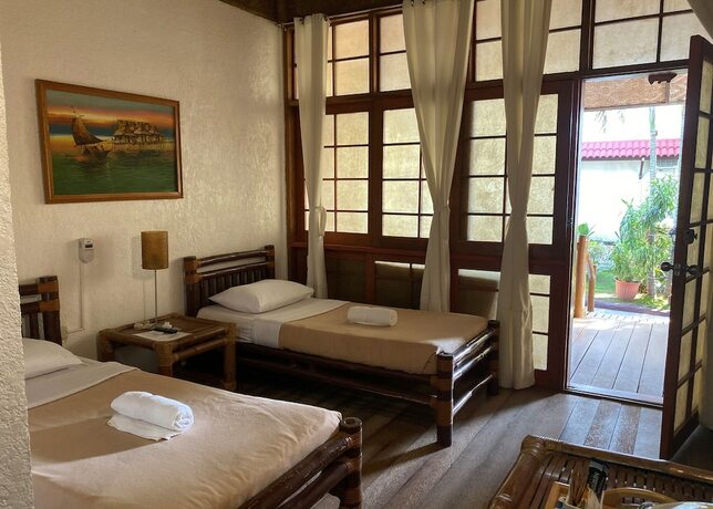 Imagen de la habitación del Hotel Marina Village Resort Moalboal. Foto 11