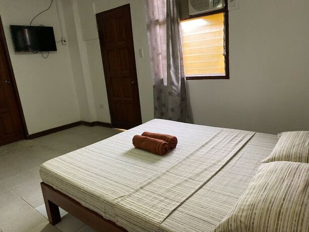 Imagen de la habitación del Hotel Marina Village Resort Moalboal. Foto 12