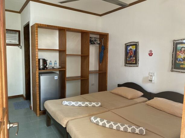Imagen de la habitación del Hotel Marina Village Resort Moalboal. Foto 18