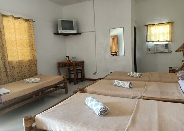 Imagen de la habitación del Hotel Marina Village Resort Moalboal. Foto 19