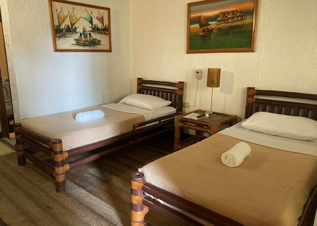 Imagen de la habitación del Hotel Marina Village Resort Moalboal. Foto 20