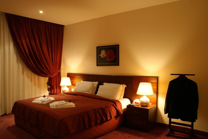 Imagen de la habitación del Hotel Markazia Suites. Foto 11