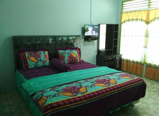 Imagen de la habitación del Hotel Marroan Guest House. Foto 12