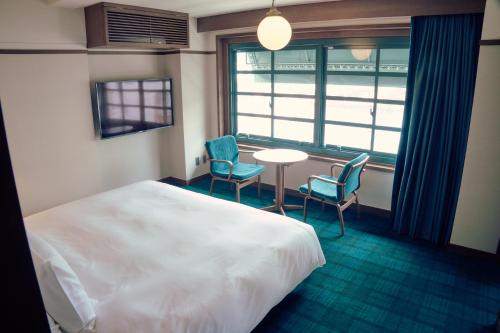 Imagen de la habitación del Hotel Marufukuro. Foto 20