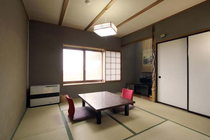 Imagen de la habitación del Hotel Maruike. Foto 17