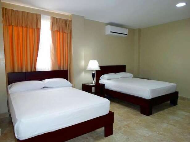Imagen de la habitación del Hotel Marvento Suites. Foto 11