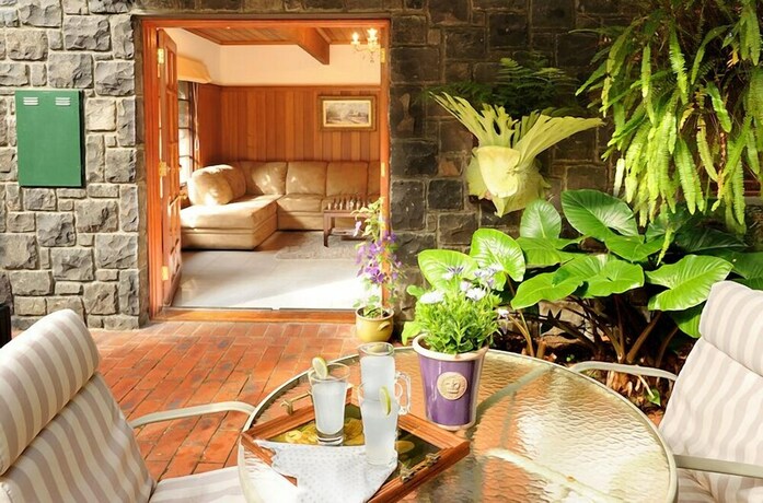 Imagen de la habitación del Hotel Mary Card's Coach House. Foto 18