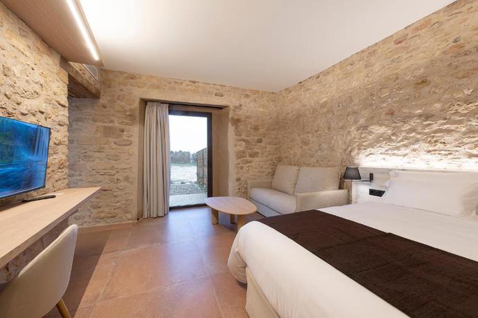 Imagen de la habitación del Hotel Mas Vidal Vilafreser. Foto 18