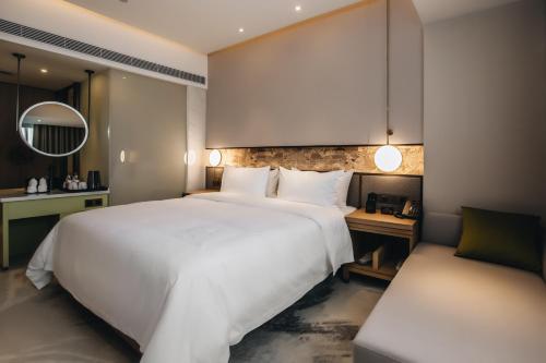 Imagen de la habitación del Hotel MasTer, tianhe. Foto 17