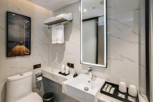 Imagen de la habitación del Hotel MasTer, tianhe. Foto 18