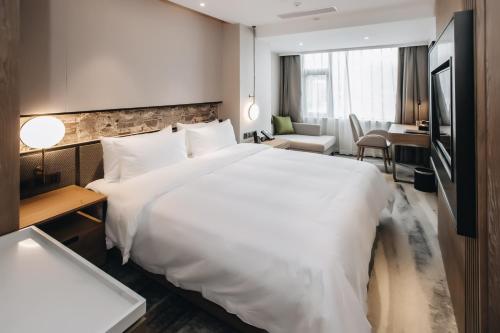 Imagen de la habitación del Hotel MasTer, tianhe. Foto 19