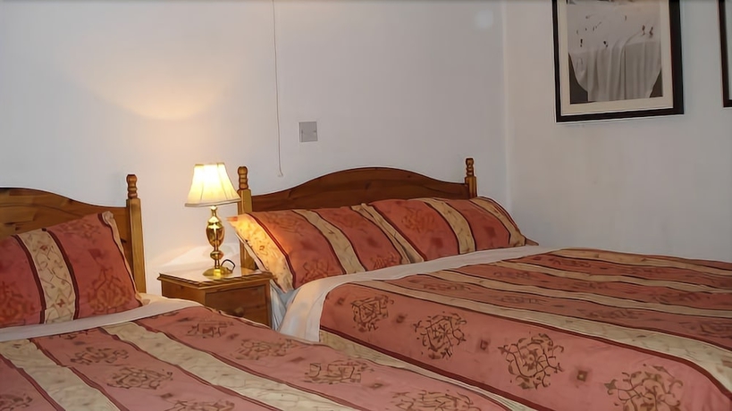Imagen de la habitación del Hotel Masslink Guest House. Foto 13