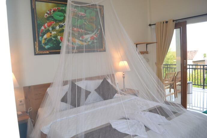 Imagen de la habitación del Hotel Master Homestay. Foto 21