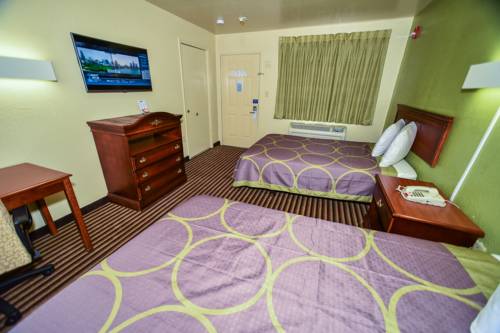 Imagen de la habitación del Hotel Masters Inn Tucker. Foto 2