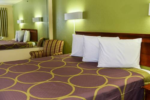 Imagen de la habitación del Hotel Masters Inn Tucker. Foto 3