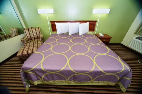 Imagen de la habitación del Hotel Masters Inn Tucker. Foto 4