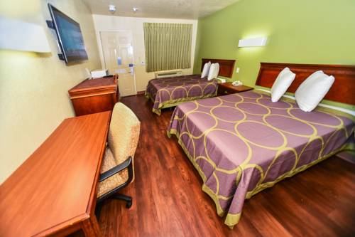 Imagen de la habitación del Hotel Masters Inn Tucker. Foto 11