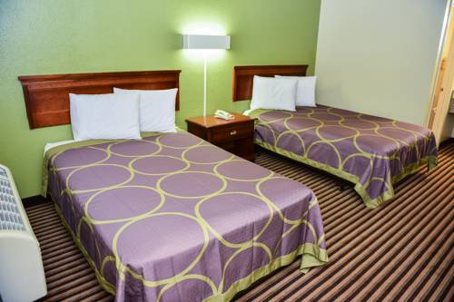 Imagen de la habitación del Hotel Masters Inn Tucker. Foto 12