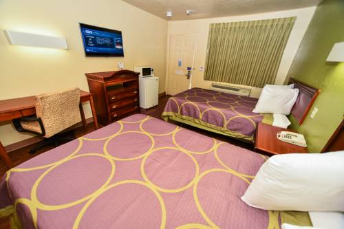 Imagen de la habitación del Hotel Masters Inn Tucker. Foto 14
