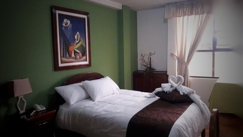 Imagen de la habitación del Hotel Master's Suite. Foto 17