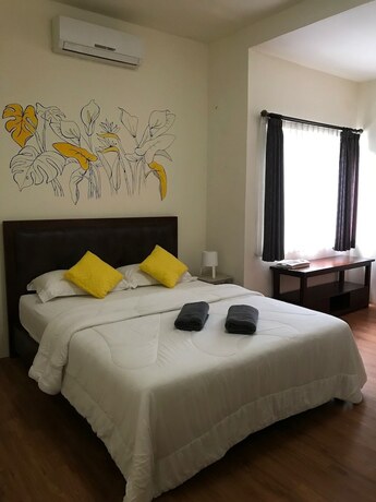 Imagen de la habitación del Hotel Matta Lodge Bali. Foto 18