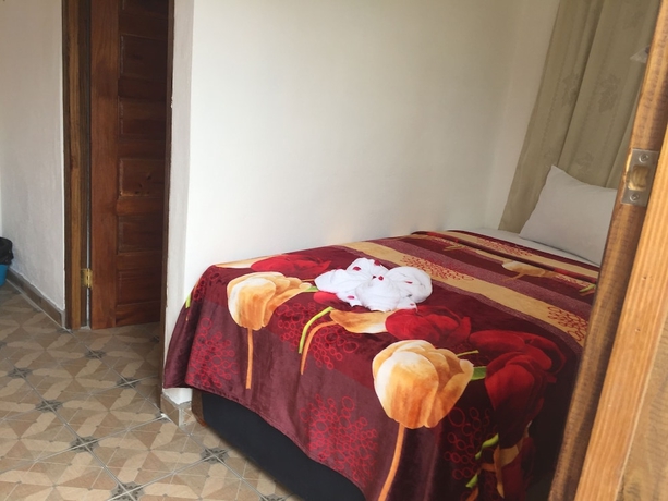 Imagen de la habitación del Hotel Matus Guest House. Foto 11