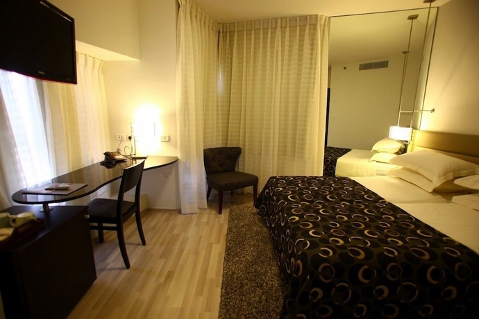 Imagen de la habitación del Hotel Maxim Tel Aviv. Foto 14