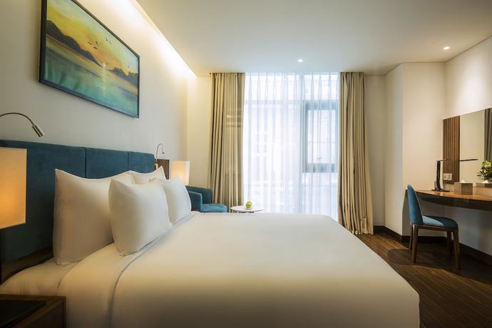 Imagen de la habitación del Hotel Maximilan Danang Beach. Foto 7