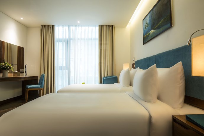 Imagen de la habitación del Hotel Maximilan Danang Beach. Foto 18