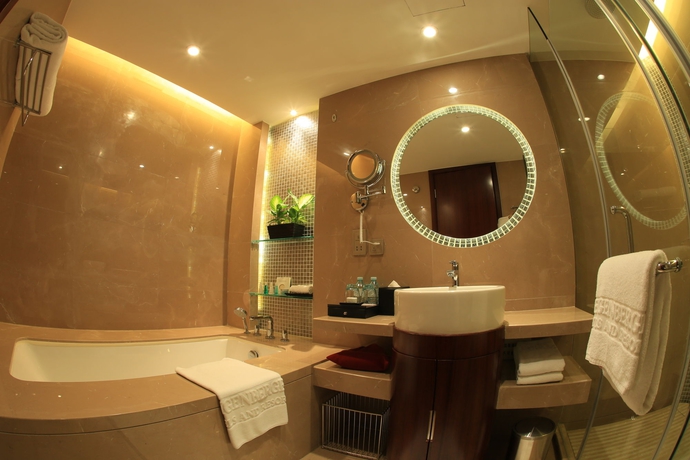 Imagen de la habitación del Hotel Maximilian Beijing. Foto 12