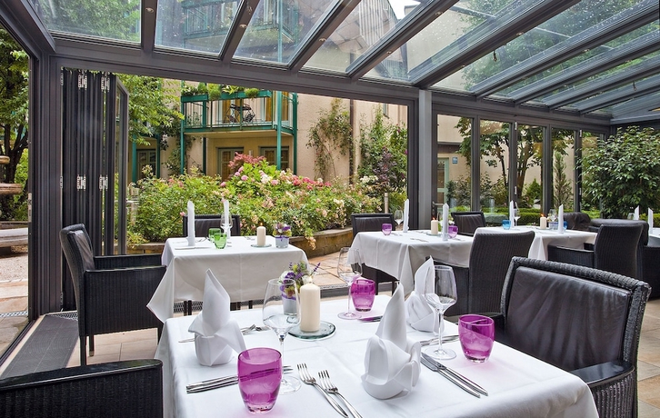 Imagen del bar/restaurante del Hotel Maximilian Munich Apartments and. Foto 2