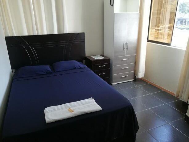 Imagen de la habitación del Hotel Maxy's Inn and Suite. Foto 13