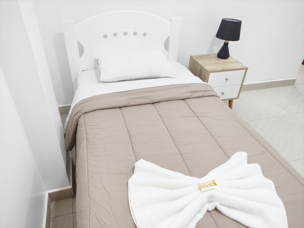 Imagen de la habitación del Hotel Maxy's Inn and Suite. Foto 15