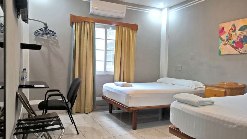 Imagen de la habitación del Hotel Maya Bella Downtown. Foto 7