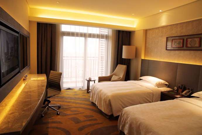 Imagen de la habitación del Hotel Maya Gleetour Wuhan. Foto 12