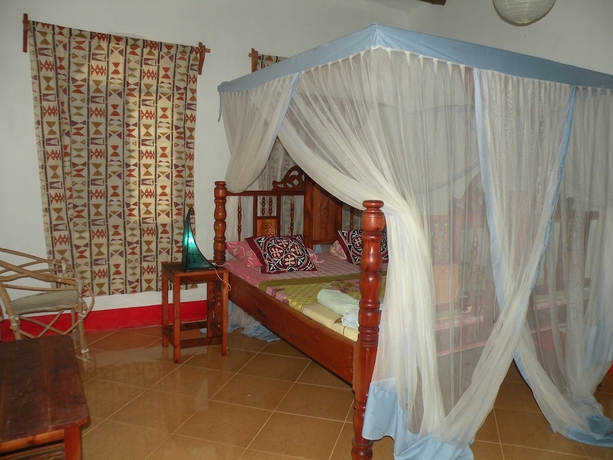 Imagen de la habitación del Hotel Mbuyuni Beach Village - Bungalows. Foto 6