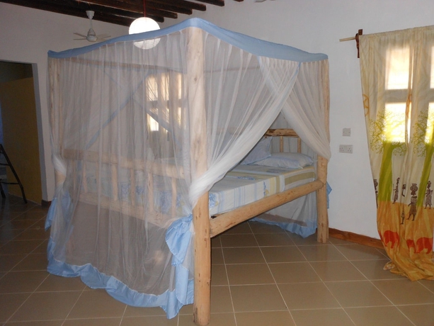 Imagen de la habitación del Hotel Mbuyuni Beach Village - Bungalows. Foto 11