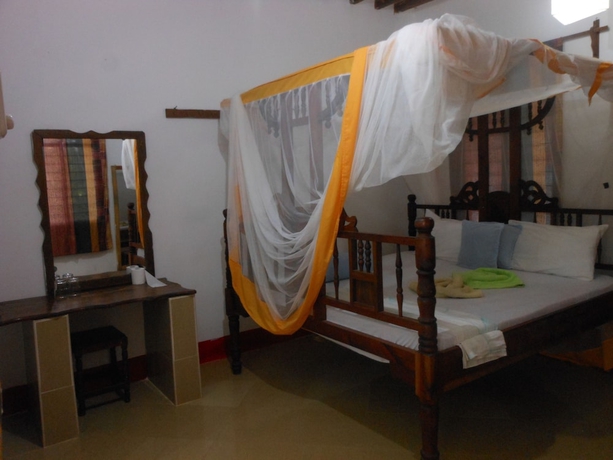 Imagen de la habitación del Hotel Mbuyuni Beach Village - Bungalows. Foto 13