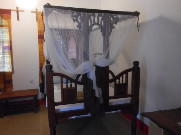 Imagen de la habitación del Hotel Mbuyuni Beach Village - Bungalows. Foto 14