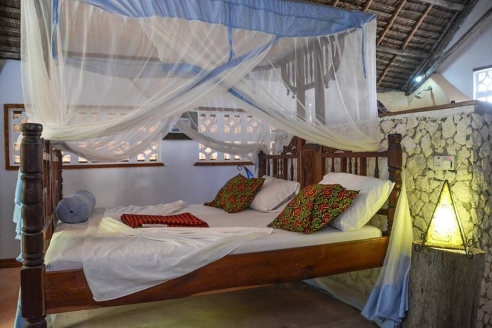 Imagen de la habitación del Hotel Mbuyuni Beach Village - Bungalows. Foto 17