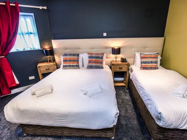 Imagen de la habitación del Hotel Mc Kevitts Village. Foto 4