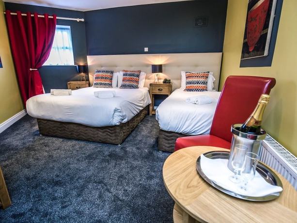 Imagen de la habitación del Hotel Mc Kevitts Village. Foto 6