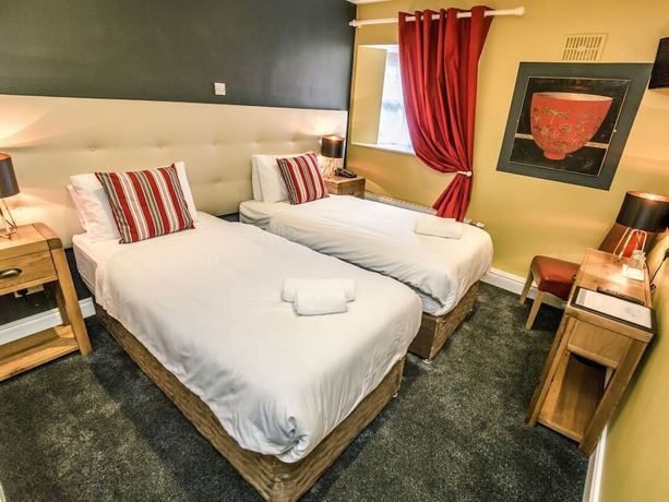 Imagen de la habitación del Hotel Mc Kevitts Village. Foto 7