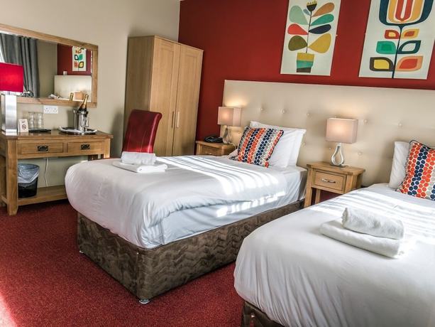 Imagen de la habitación del Hotel Mc Kevitts Village. Foto 9
