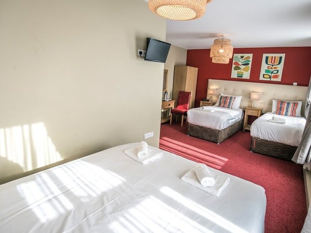 Imagen de la habitación del Hotel Mc Kevitts Village. Foto 11