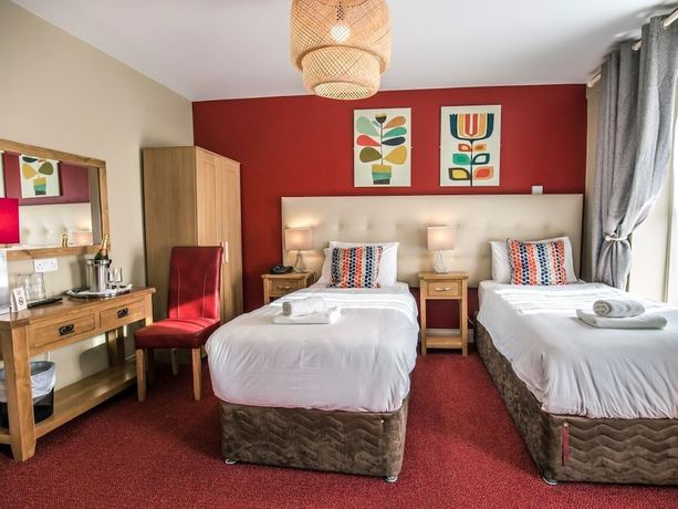 Imagen de la habitación del Hotel Mc Kevitts Village. Foto 13