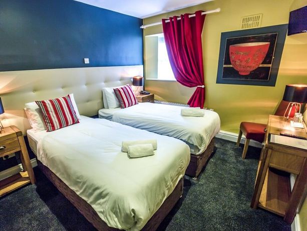 Imagen de la habitación del Hotel Mc Kevitts Village. Foto 14